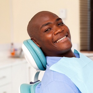 man smiling and getting All-On-4 implants and not traditional implants