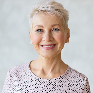 Smiling senior enjoying benefits of Teeth in a Day