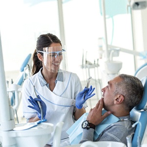 Dentist explaining benefits of dental implants in Jupiter, FL.