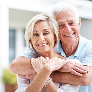 Smiling older man and woman outdoors
