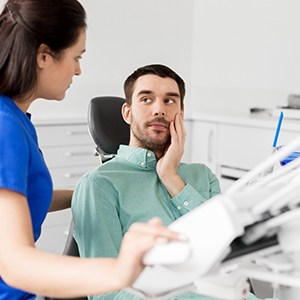 Patient listening to an emergency oral surgeon in Jupiter speak