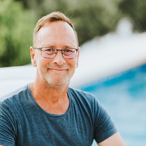 Man with closed-mouth smile, thinking about full mouth reconstruction