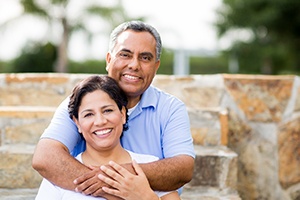 Smiling couple with dental implants in Jupiter