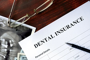 Dental insurance paperwork for the cost of dental implants in Jupiter