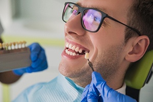 Patient smiles while getting dental implants in Jupiter