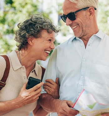 Smiling older man and woman outdoors