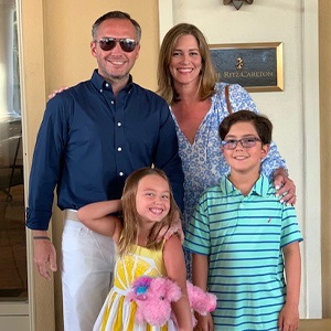 Dr. Guzman and his family indoors