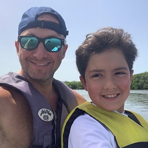 Dr. Guzman and son at the lake