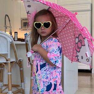 Dr. Guzman's daughter with an umbrella