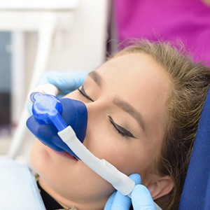 young woman with nitrous oxide mask 