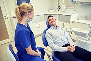 man smiling at his dentist 