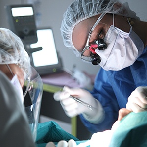 Oral surgeon performing procedure