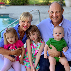 Dr. Weinstein and family by the pool