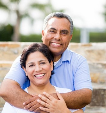 A smiling couple with dental implants in Royal Palm Beach.