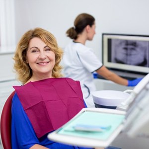 An older woman at her dental appointment.