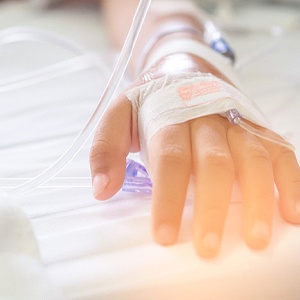 Close-up of patient’s hand receiving IV for sedation dentistry