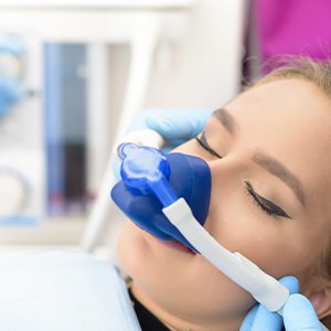 Woman with nitrous oxide nose mask