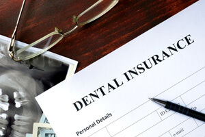 a dental insurance form next to an xray image