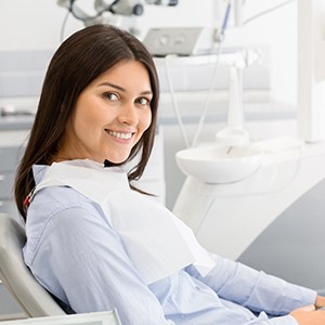 Female dental patient smiling after wisdom tooth extraction in Jupiter, FL