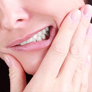 Closeup of patient holding jaw