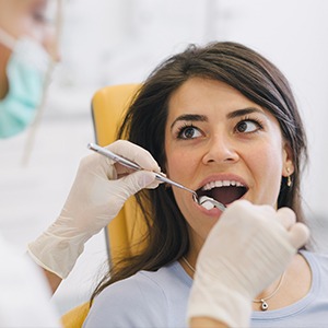 Woman receiving oral surgery treatment