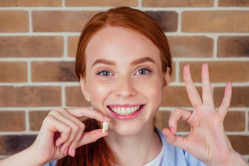 Woman overcoming her fear of tooth extractions