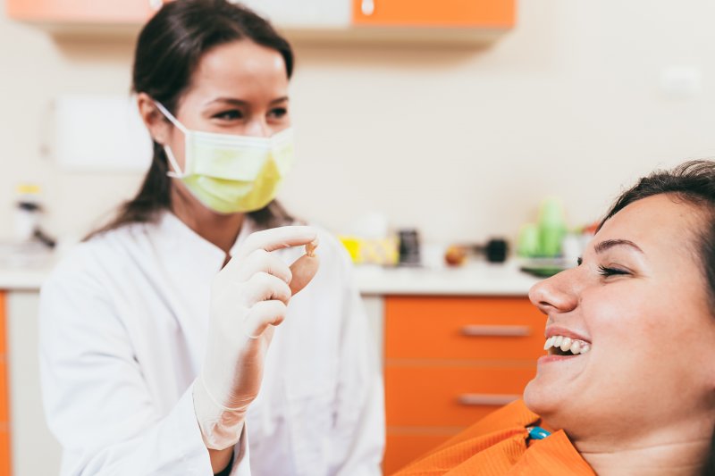 dentist showing results of tooth extraction in West Palm Beach