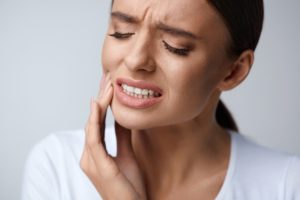 Woman with dental pain after an extraction