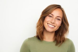 a patient smiling after wisdom tooth extraction