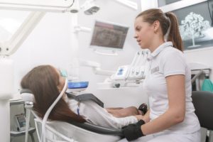 a patient visiting the dentist and receiving sedation