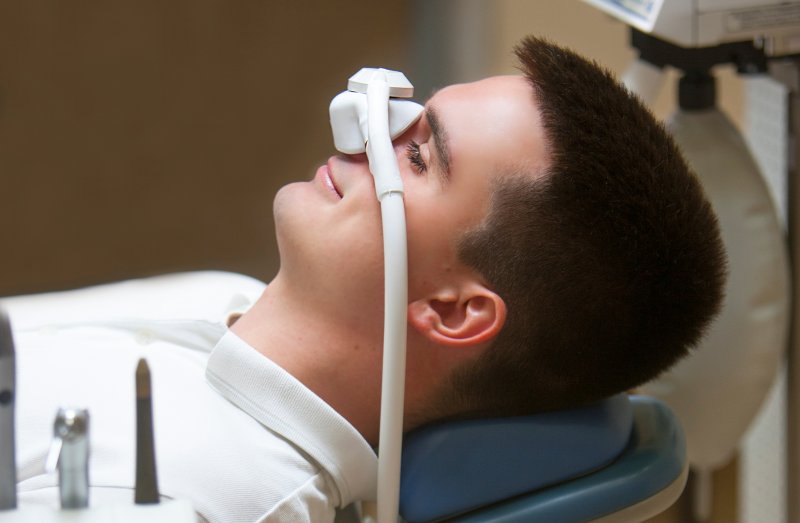 Patient using nitrous oxide at their dental appointment